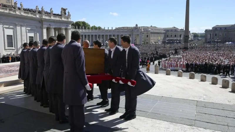 Pallbearers prepare Pope's coffin for final journey