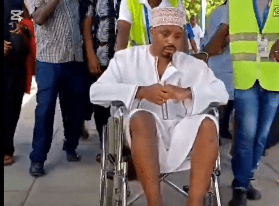 Mwangi wheeled into airport, heads for specialised care