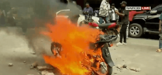 Motorcycle torched, rider clobbered in CBD demos