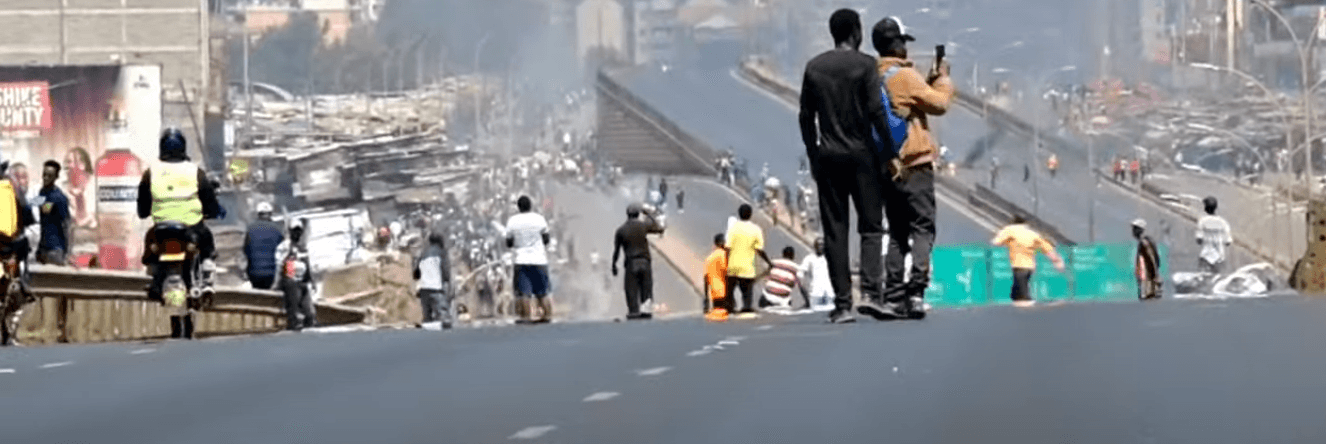 Protesters play football on Thika road
