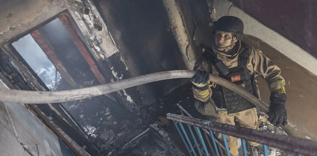 Buildings burn as another wave of Russian attacks hits Ukraine