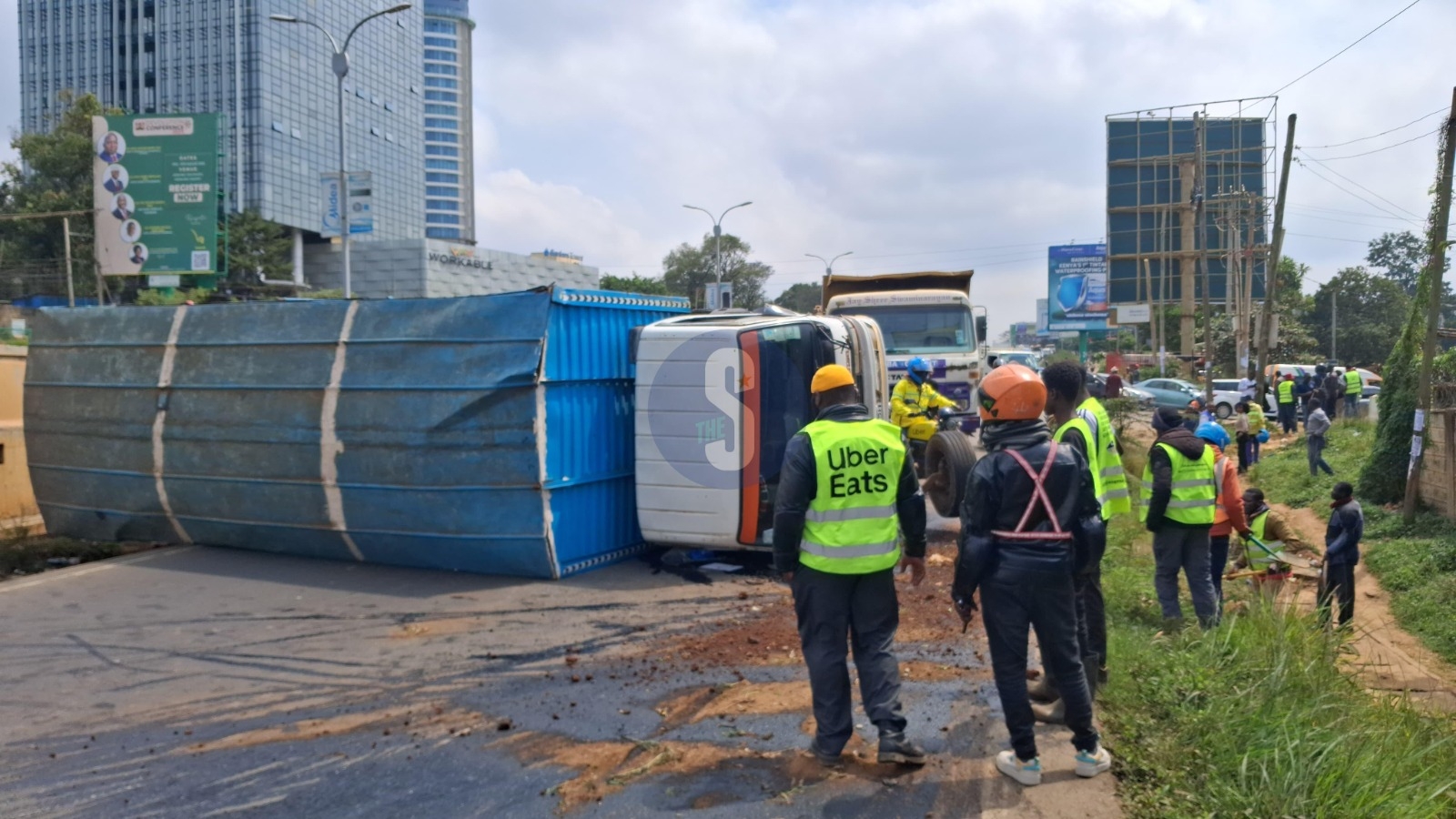 PHOTOS: Lorry carrying chicken feed overturns along Waiyaki Way