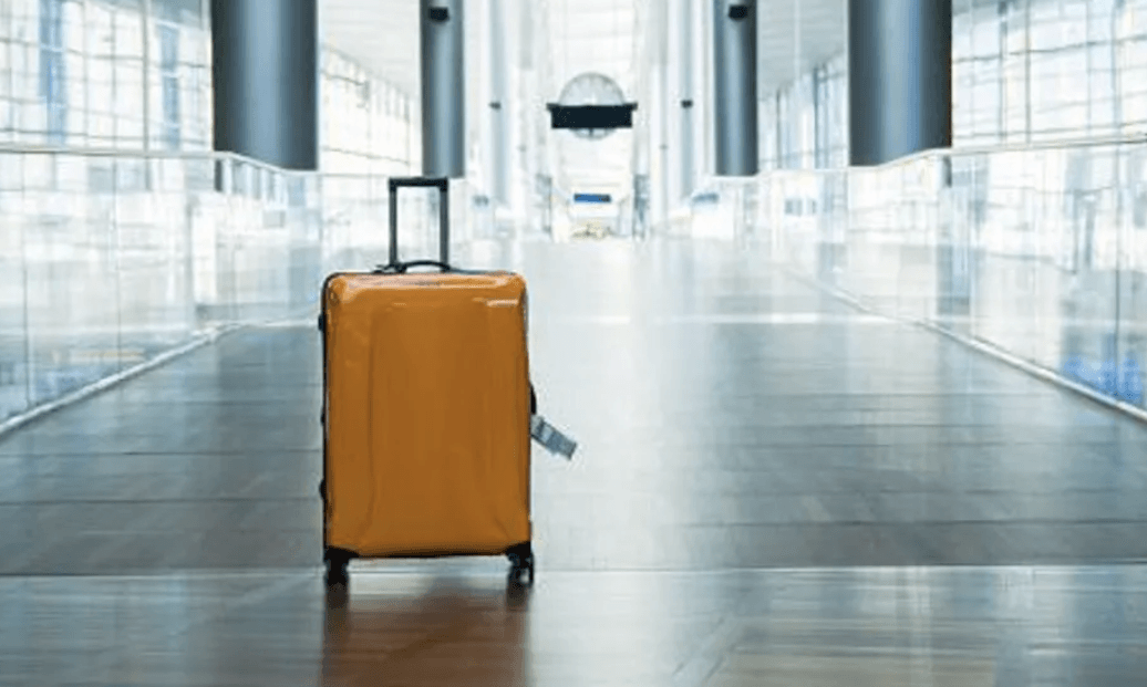 New Zealand woman arrested after two-year-old found in luggage