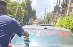 Outrage after officer seen spray-painting parked car