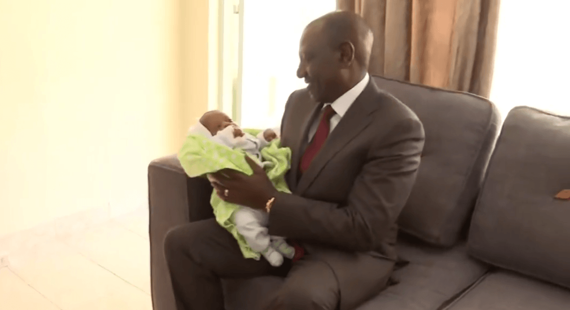 Ruto cradles newborn during visit to Embakasi police college