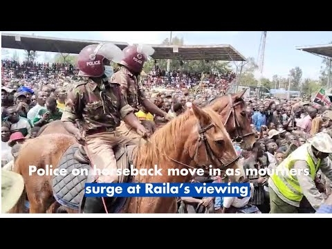 Police on horseback move in as mourners surge at Raila’s viewing
