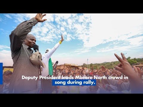 Deputy President leads Mbeere North crowd in song during rally.
